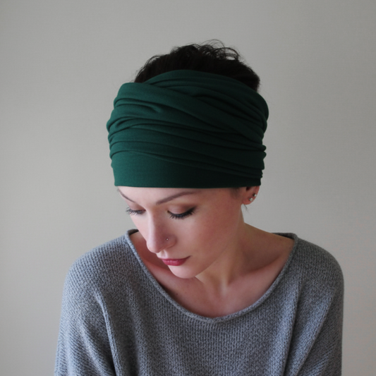 woman wearing a forest green head scarf