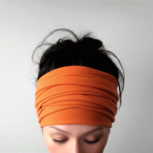 woman wearing a tangerine orange ecoshag head wrap